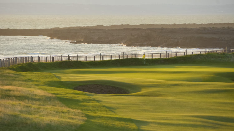 A view of the 2nd green bordered by out of bounds at Royal Porthcawl Golf Club