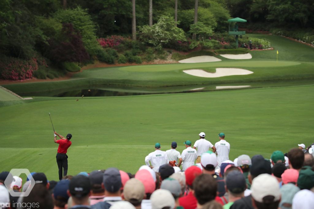 Tiger Woods (USA) plays a shot on the 12th hole during the final round of the 2019 Masters golf tournament at the Augusta National Golf Club