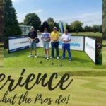 A photo of my fourball with the 2020protour Experience what the Pro's Do advert in the background