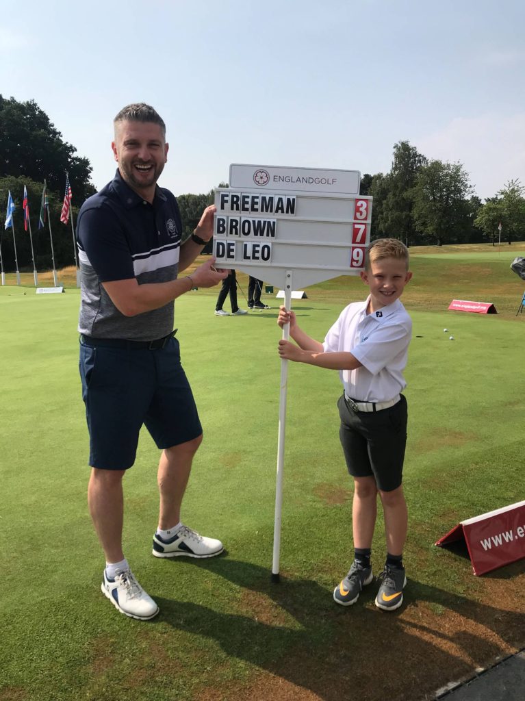 Photograph of Paul and his son Zach with the Scoreboard for the final group in the Carris Trophy, by kind permission of Paul Hemlin