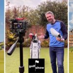 A photograph of Paul Hemlin filming an episode of the Golf Show set against the backdrop of the Old Course at St Andrews
