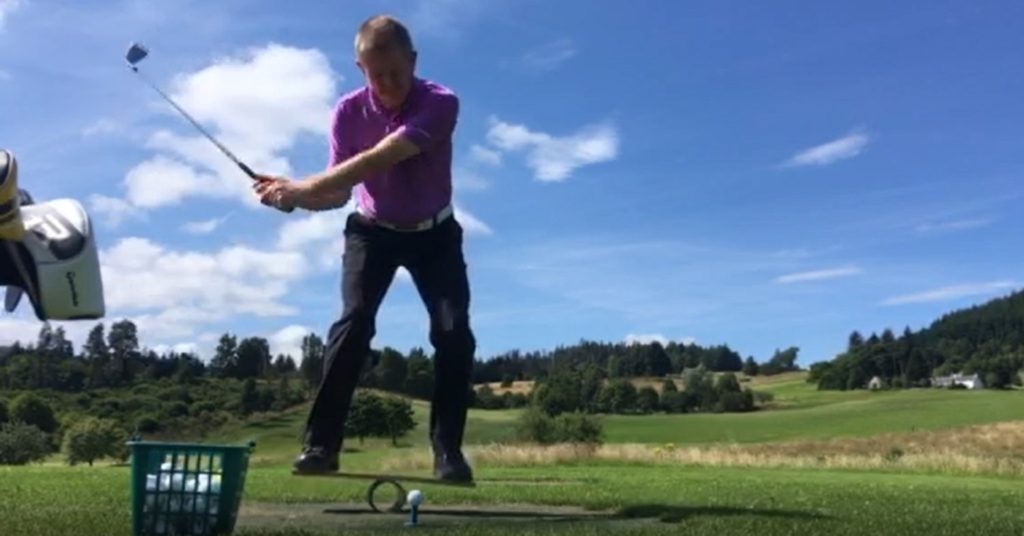 A photograph of Graeme Fish attempted a trick shot whilst balancing on a cut down see-saw, by kind permission of Graeme Fish
