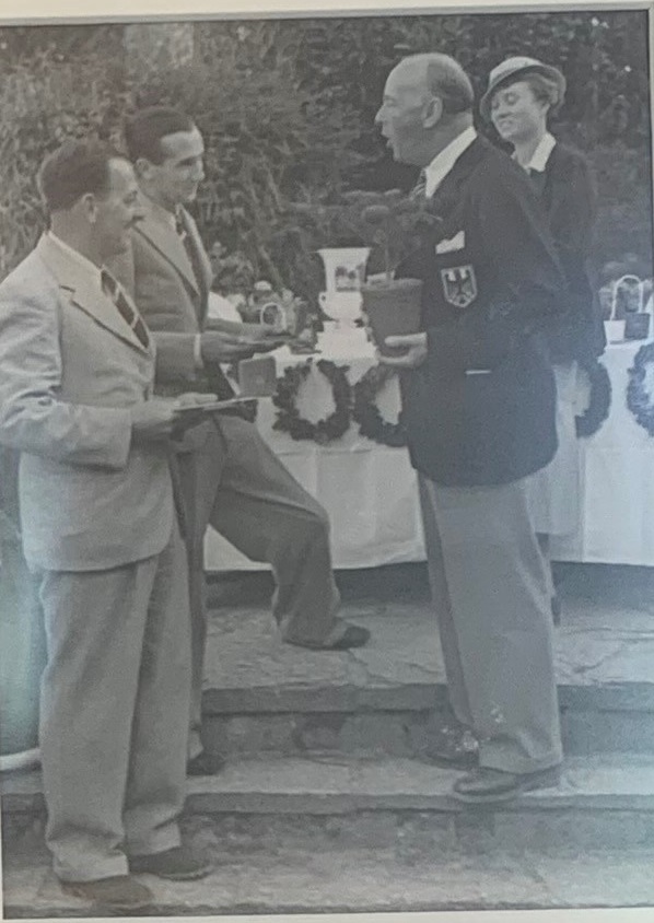 Photograph of Tom Thirsk and Arnold Bentley receiving the trophy, medals and fir trees from Karl Henkell, by kind permission of Ganton Golf Club