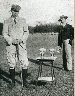 Photograph of Charles Sands at the victory presentation with Monsieur Fournier-Sarlovèze (one of the golf event organisers) in the background