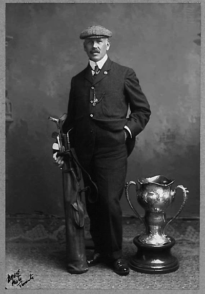 Photograph of George Lyon with his golf clubs and the Olympic Trophy, by kind permission of Lambton Golf & Country Club