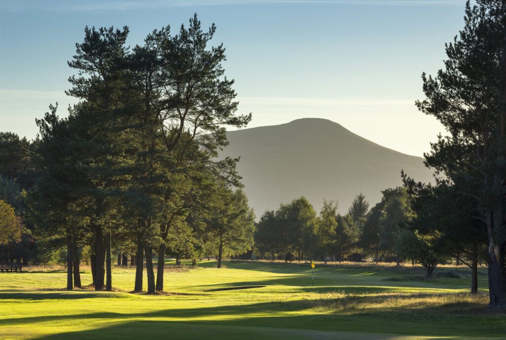 A view of the 1st green from the 2nd fairway, looking towards the East Lomond Hills ... by kind permission of Ladybank Golf Club